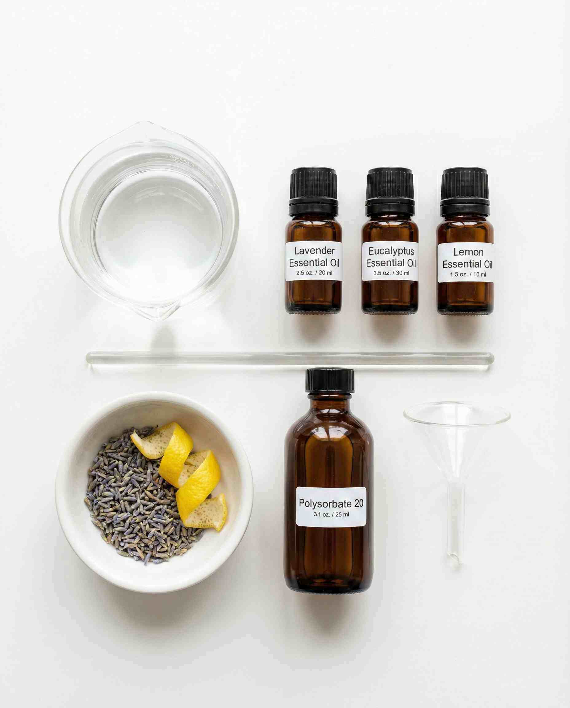 Flat lay of DIY skincare ingredients including a beaker of water, essential oils, funnel, and Polysorbate 20 on a white laboratory surface.