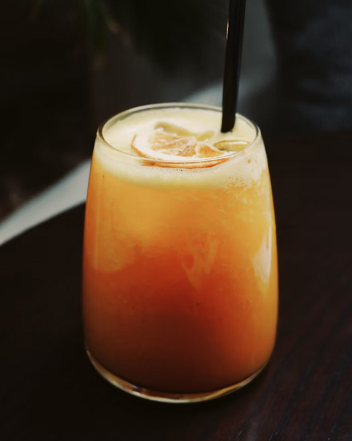 Frothy orange beverage showing foam stability and oil solubilization using Polysorbate 80.